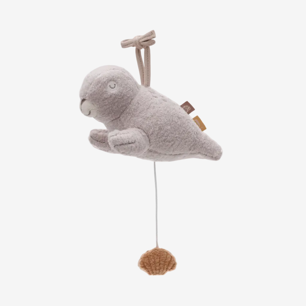 Gray plush seal toy with a wooden propeller on a white background