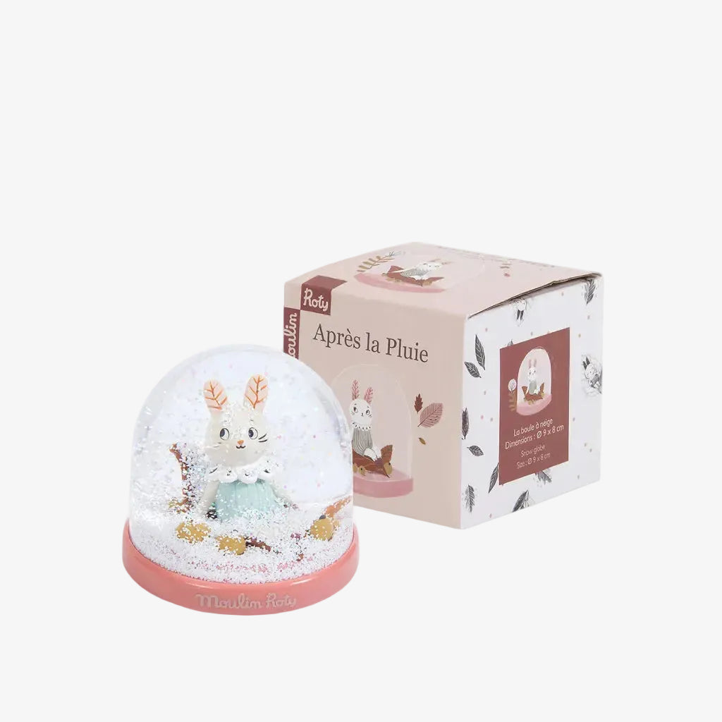 Snow globe with rabbit design and packaging on a white background