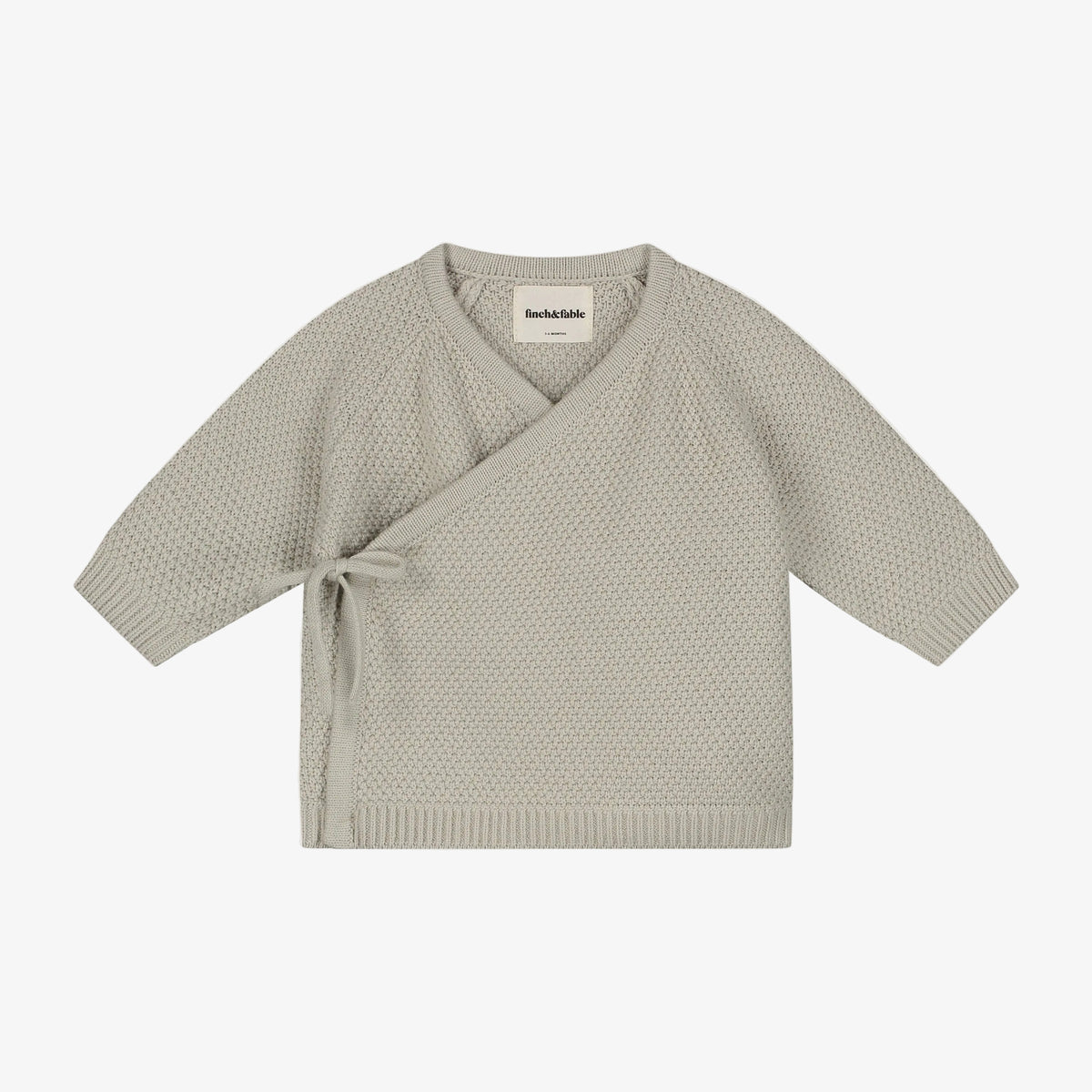 Light gray knit cardigan on a light gray background 