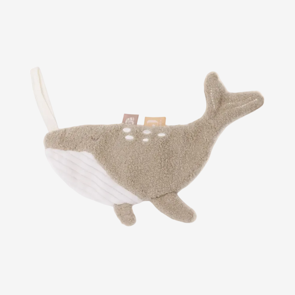 Plush whale toy with a white belly on a white background