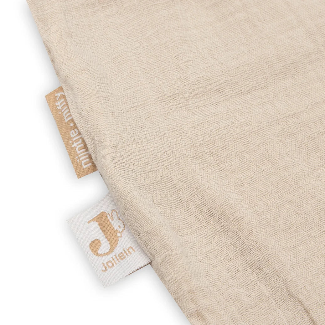Beige fabric with Jollein branding on a white background