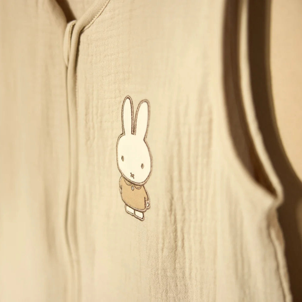 Beige hoodie with a cartoon rabbit design on a beige background