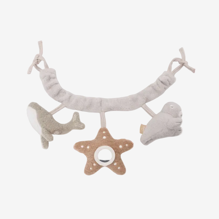 Baby mobile with starfish, whale, and cloud shapes on a white background